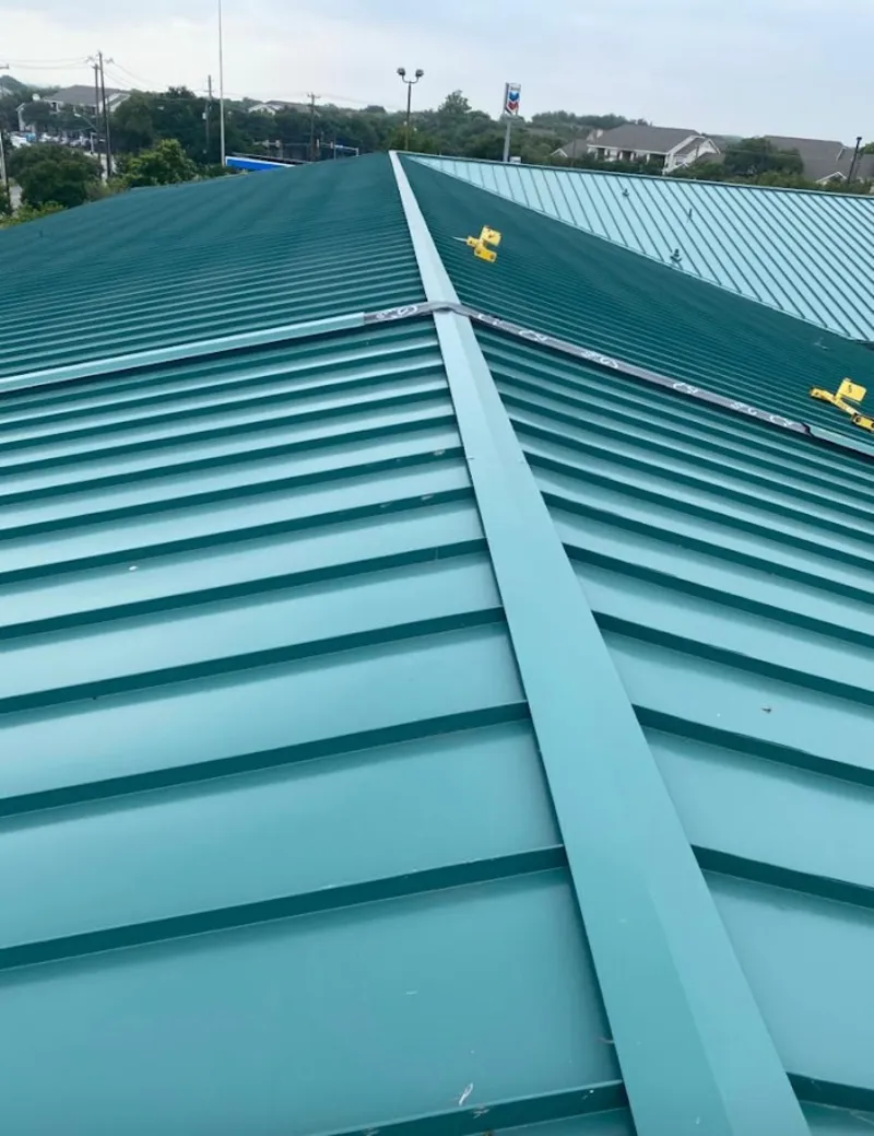 Green commercial metal roof ridge and valley for Metal Roof Repair in North Logan